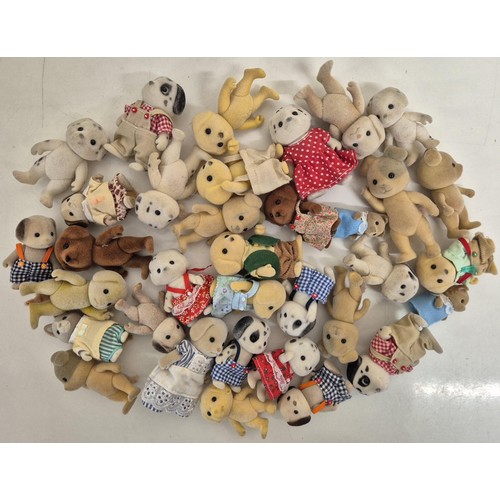 4448 - A collection of approximately 35 unboxed Sylvanian Family dog figures.