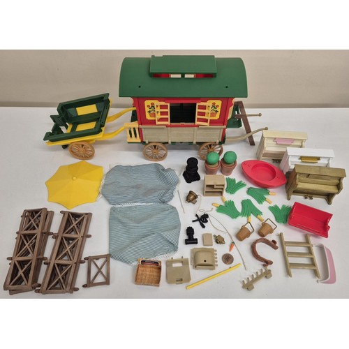 4451 - A miscellaneous collection of Sylvanian Family unboxed accessories & gypsy wagon.