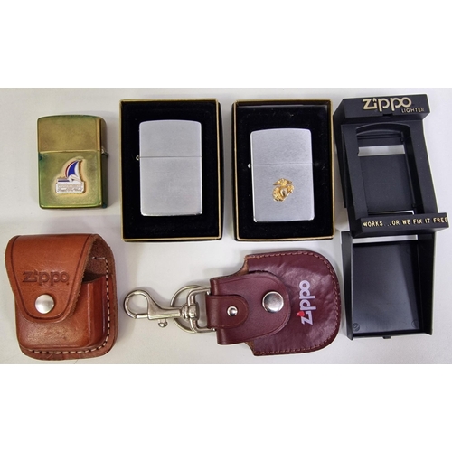 5019 - A collection of ten Zippo lighters, together with a pair of carry cases.