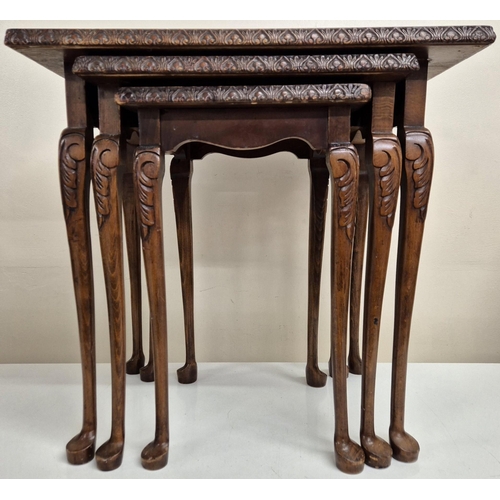 5050 - A Queen Anne-style, walnut nest of three tables, each with glass protector. Largest dimensions(cm) H... 