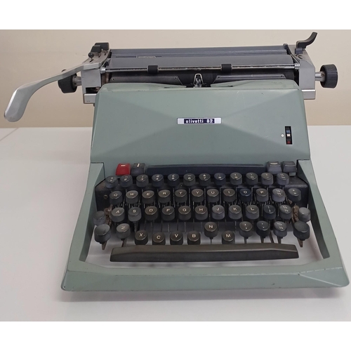 5054 - A mid-century, Olivetti 82 manual typewriter (rarer, as made in Glasgow). Appears in working order.