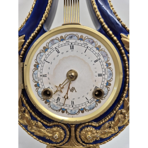 5057 - A reproduction Marie Antoinette clock (original held in V&A Museum). Blue glazed porcelain with gilt... 