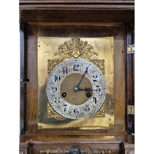 5058 - An imposing 19th century German 'Wurttemberg' 14-day, oak mantle clock. Complete with key. Tested & ... 