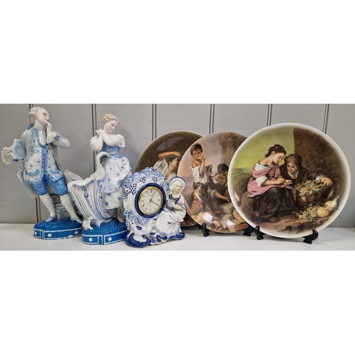 5064 - A mixed lot of decorative ceramic pieces. To include a set of three German display plates, a pair of... 