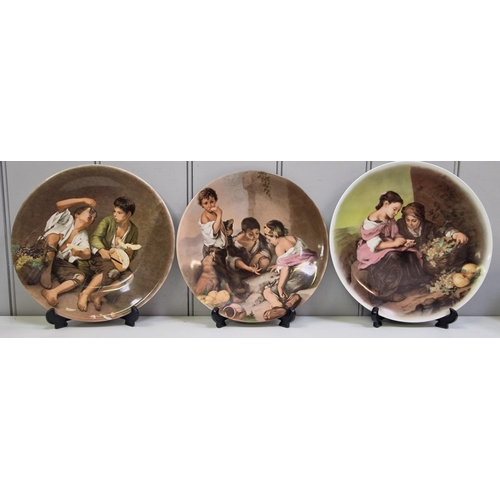 5064 - A mixed lot of decorative ceramic pieces. To include a set of three German display plates, a pair of... 