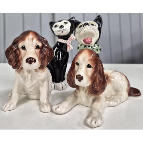 5178 - A collection of four cat and dog figures. To include a 'Sylvac' example. Tallest 16.5cm.