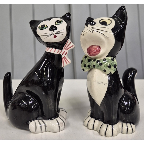 5178 - A collection of four cat and dog figures. To include a 'Sylvac' example. Tallest 16.5cm.