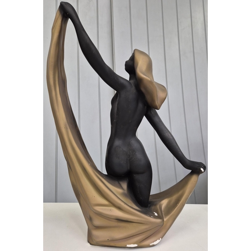 5185 - A large scale, art deco-style figurine. Cast plaster. Height 47cm.