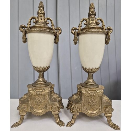 5198 - A late 20th century clock garniture, by Franz Hermle Lancini. Brass cased, with ceramic panelling, d... 