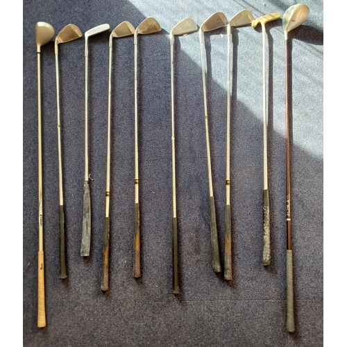 6296 - A set of ten golf clubs, with vintage bag. Makers include Oakwood, Prodrive, Progold, etc.