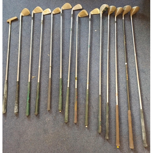 6297 - A set of fourteen vintage golf clubs, with bag.