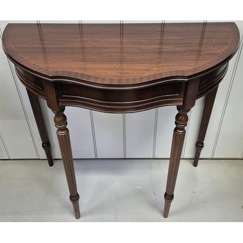 6309 - A mahogany-veneered demi lune occasional table, with single frieze drawer. Dimensions(cm) H76, W83, ... 