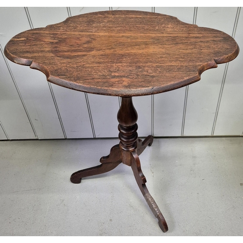 6314 - A vintage mahogany occasional table, with tilt mechanism (damage to leg), together with a piecrust t... 