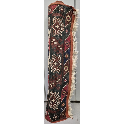 6316 - A fringed, geometric-pattern, Turkish rug. Dimensions 141cm x 93cm.