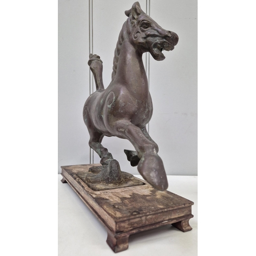 6321 - A vintage Chinese plinthed bronze sculpture, after 'The Flying Horse of Gansu'. Dimensions(cm) H31, ... 