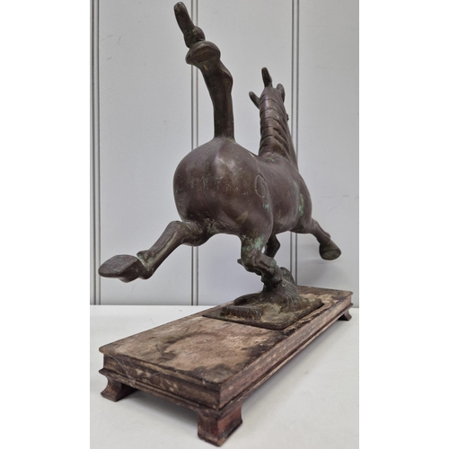 6321 - A vintage Chinese plinthed bronze sculpture, after 'The Flying Horse of Gansu'. Dimensions(cm) H31, ... 