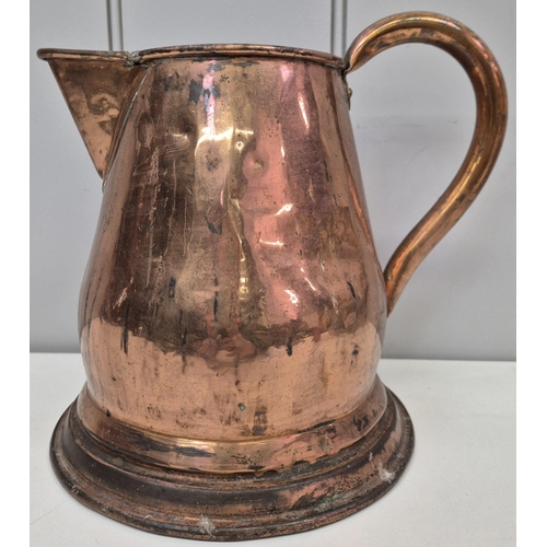 6323 - A vintage copper jug, together with a fire irons set on horseshoe stand. Jug height 23cm, fire irons... 