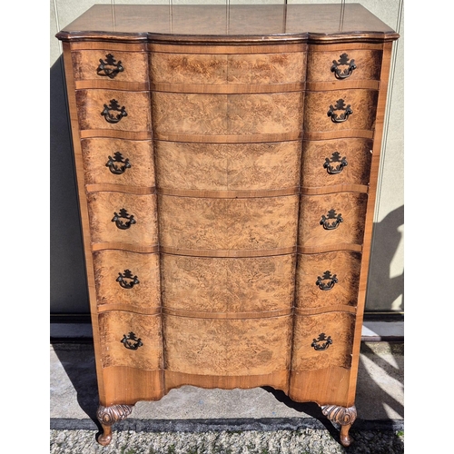 6327 - A stunning burr walnut chest of six graduated drawers, supported by Queen Anne style legs. Dimension... 