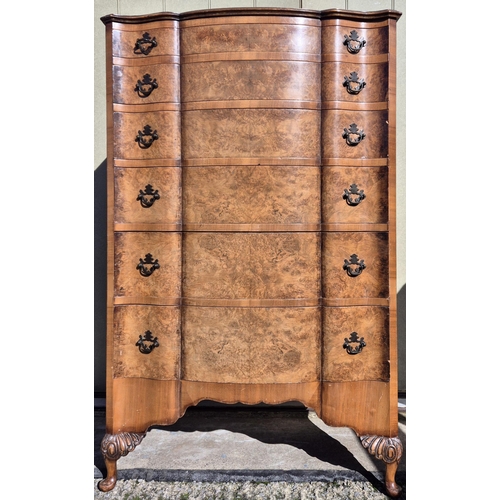 6327 - A stunning burr walnut chest of six graduated drawers, supported by Queen Anne style legs. Dimension... 