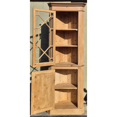 6330 - A solid pine corner display cabinet. Dimensions(cm) H198, W72, D34.