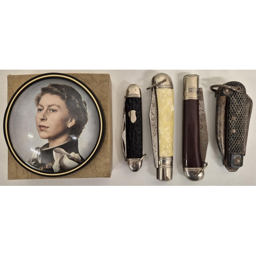 6333 - A collection of four vintage penknives, together with a boxed Queen Elizabeth II paperweight, by Nig... 