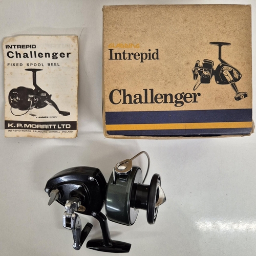 6334 - Two boxed Gladding fishing reels & a tobacco tin full of hooks & weights,