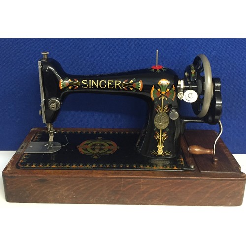 6343 - A Singer sewing machine & original case. Serial no. F7647946. Dates to 1917. complete with instructi... 