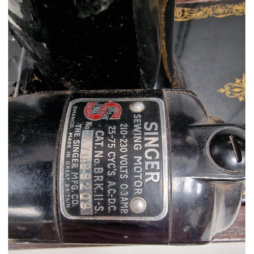 5063 - A 1944 Singer sewing machine, with case. Dates to 1944, with Singer electrification unit. Will requi... 