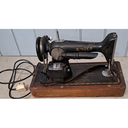 5069 - An early electric Singer Sewing Machine. Will require re-wiring if use considered.