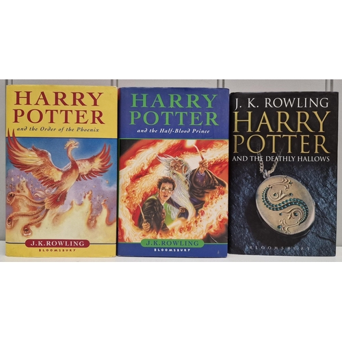 5141 - A collection of three Harry Potter first edition books, with dust jackets.