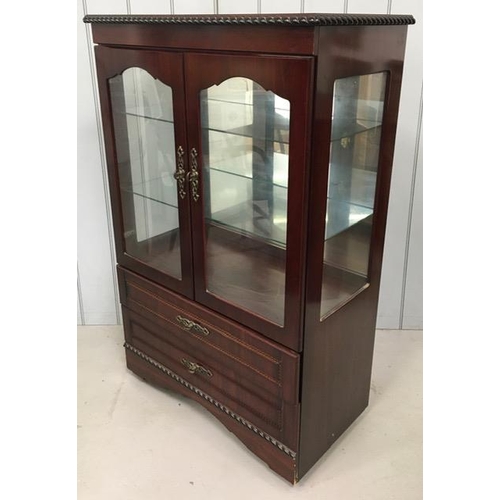 5238 - A reproduction, mahogany coloured glazed display cabinet. Features a display area with two internal ... 