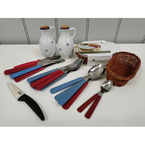 6399 - A mixed lot of tableware. To include oil/vinegar bottles, retro cutlery, wicker basket etc.