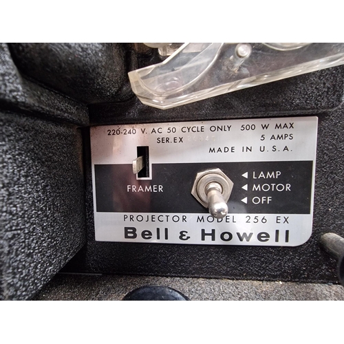 5210 - A vintage 8mm film projector & accessories, by 'Bell & Howell'. Modle no. 256EX. Will require wiring... 
