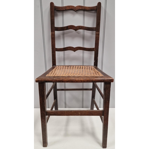 6107 - An Edwardian ladder back chair, with woven cane seat. Dimensions(cm) H83(42 to seat), W39, D35.