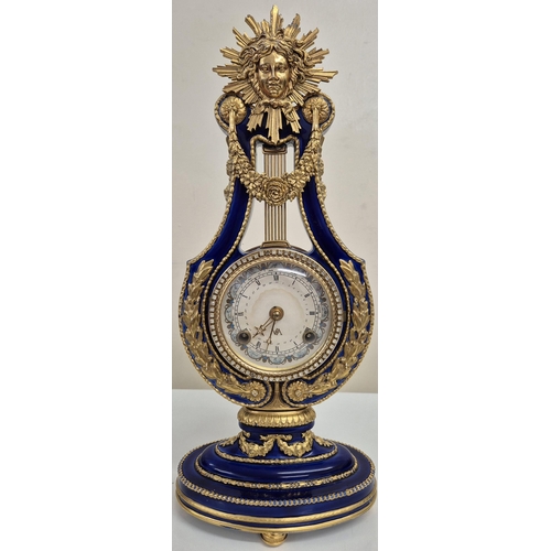 5057 - A reproduction Marie Antoinette clock (original held in V&A Museum). Blue glazed porcelain with gilt... 