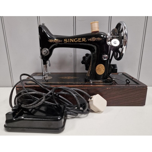 5063 - A 1944 Singer sewing machine, with case. Dates to 1944, with Singer electrification unit. Will requi... 