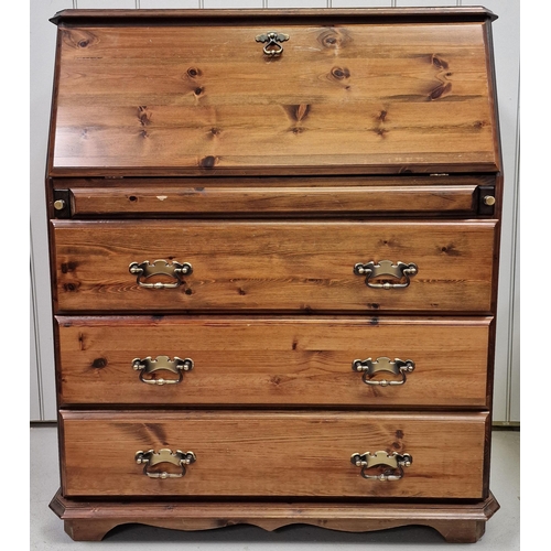 6110 - A vintage, solid pine bureau. Features fall front desk area, over three drawers, with brass handles.... 