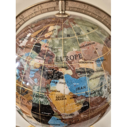 4834 - A rotating 'Gemstone Globe'. Countries depicted by semi-precious gemstones. Height 33cm, diameter 31... 