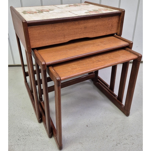 4872 - A mid-century teak nest of three tables. The larger featuring a tiled top & single drawer. Largest d... 