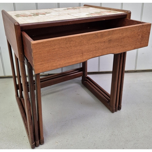 4872 - A mid-century teak nest of three tables. The larger featuring a tiled top & single drawer. Largest d... 