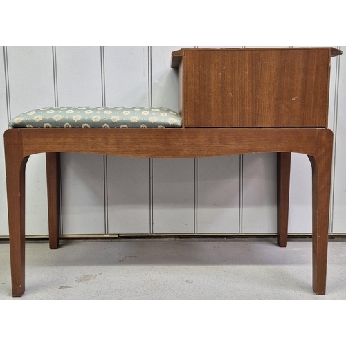 4873 - A mid-century teak telephone table. Dimensions(cm) H61, W79, D30.