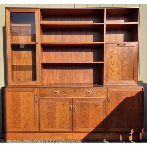 4931 - A mid-century teak, G-Plan lounge display cabinet. Features a glazed display area, bookcase & fall f... 