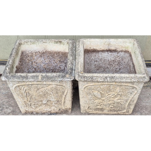 4936 - A pair of stone garden planters. Dimensions(cm) H33, W36, D36.