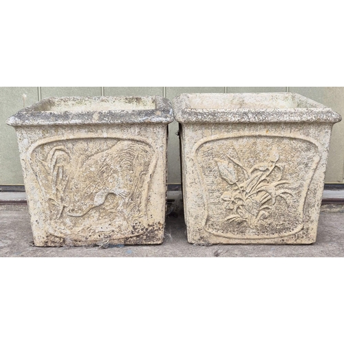 4936 - A pair of stone garden planters. Dimensions(cm) H33, W36, D36.