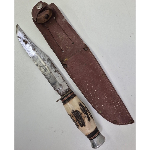 4957 - A vintage bone-handled Bowie knife, with sheath. Length 28cm. 
***Proof of age will be required befo... 