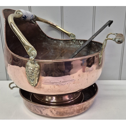 5843 - A mixed lot of decorative copperware. To include a scuttle, with brass detailing, ladle & tray pan (... 