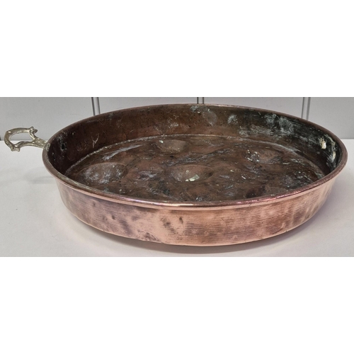 5843 - A mixed lot of decorative copperware. To include a scuttle, with brass detailing, ladle & tray pan (... 