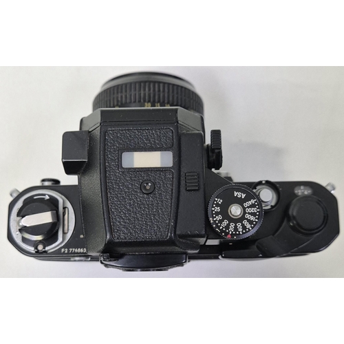 5975 - A professional Nikon F2 35mm SLR camera, with a huge range of accessories, to include six lenses, fl... 