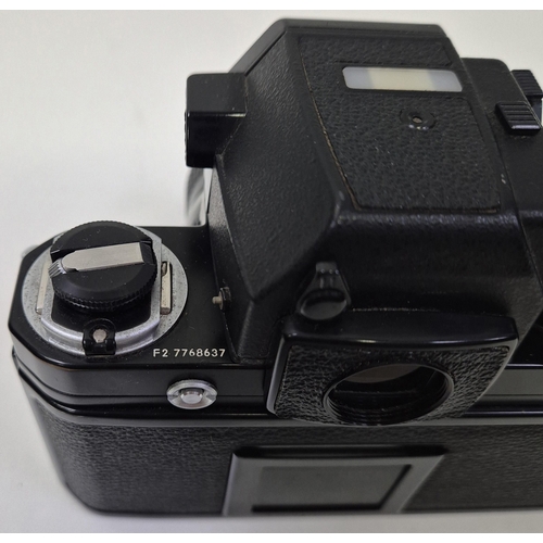 5975 - A professional Nikon F2 35mm SLR camera, with a huge range of accessories, to include six lenses, fl... 