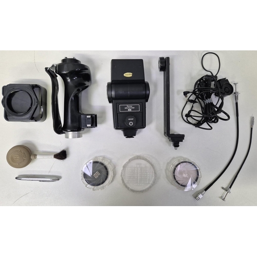 5975 - A professional Nikon F2 35mm SLR camera, with a huge range of accessories, to include six lenses, fl... 